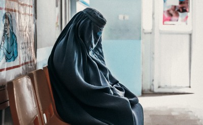A mother in the waiting room at a health clinic in Parwan province.