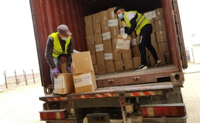Action Against Hunger staff unload supplies in Jordan.