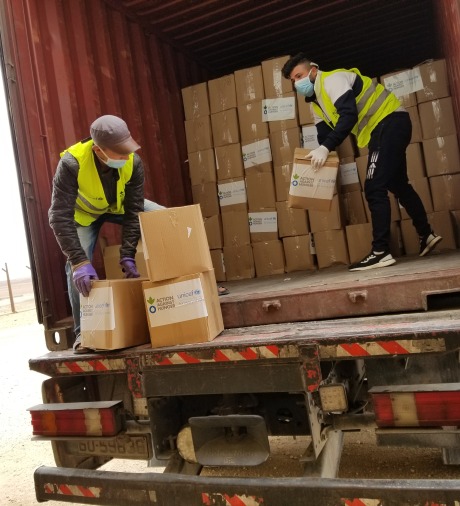 Action Against Hunger staff unload supplies in Jordan.