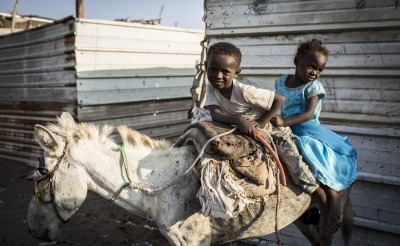 Two children on a donkey in Yemen