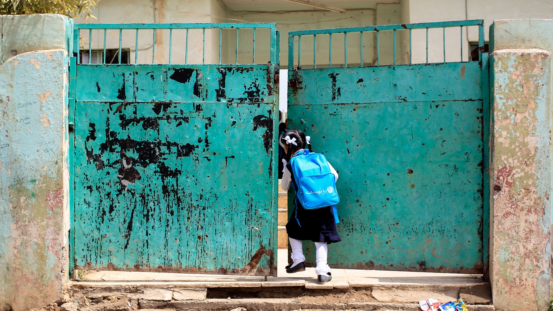 A girl heads back to school in the village of Bawiza in North Mosul, Iraq.