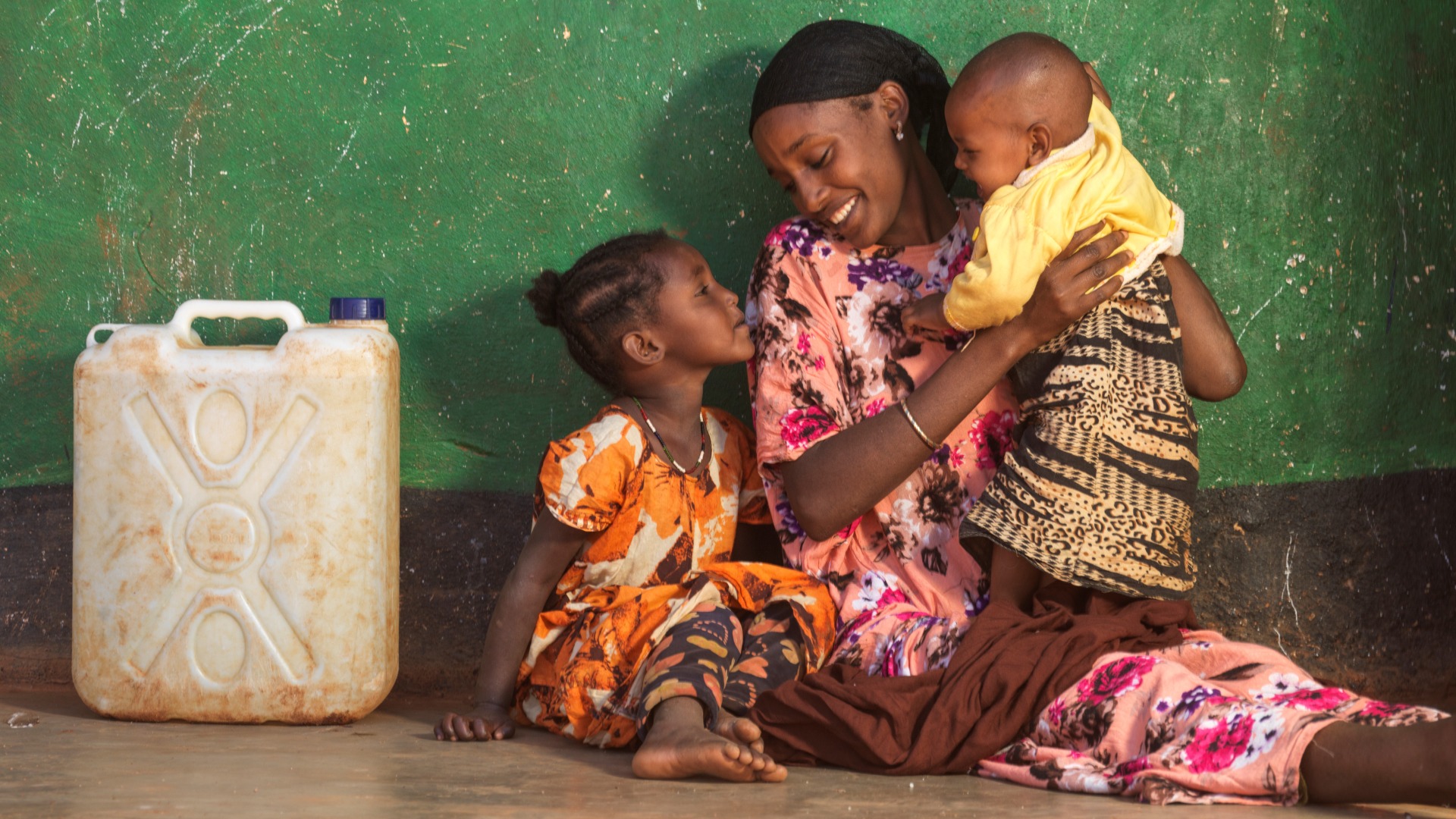 Darmi, 23, with daughters Lelo, 4, and Nadi, 1, at home in Moyale  .