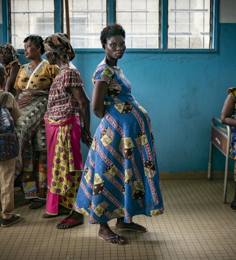A pregnant woman waits inside a health center in Bacabo, Ivory Coast.