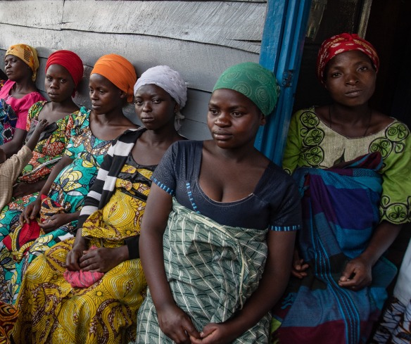 Pregnant women wait for their appointments outside of Kibarizo Health Center.