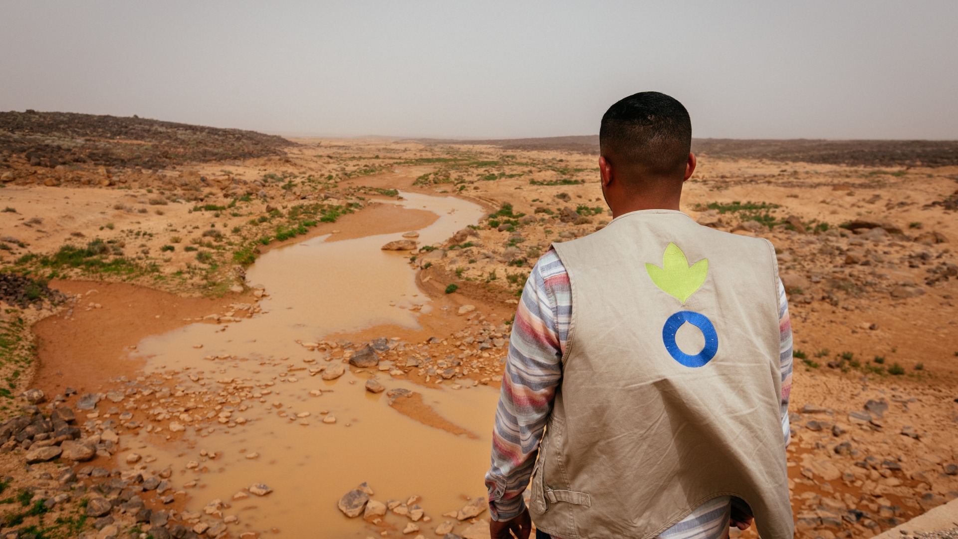 Wasfi Al Sarhan, Action Against Hunger project manager, looks out over an arid landscape in Jordan.