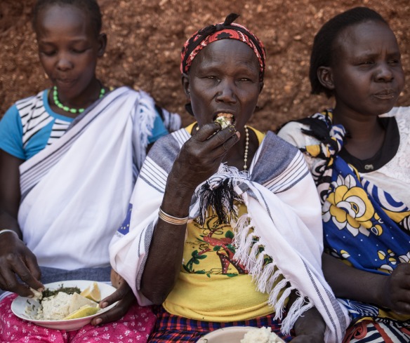 Women participate in a cooking demonstration as part of Action Against Hunger's programs in West Pokot, Kenya.