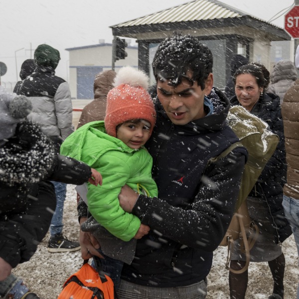 Ukrainian refugees face winter weather as they cross the border into Moldova.
