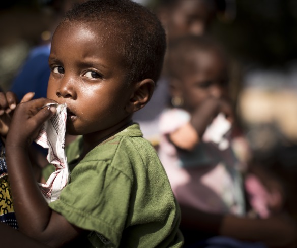A young boy eats Plumpy'Nut, the ready-to-use therapeutic food used to treat malnutrition.