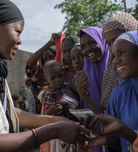 Action Against Hunger staff conduct a distribution of hundreds of shelter kits and hygiene kits to displaced people in Monguno, Borno State, Nigeria