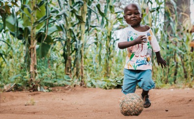 Rodrick, 4, plays with a ball at his grandparents' home.