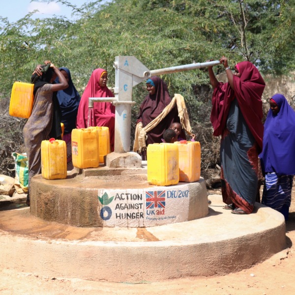 In Hudur, Somalia, women collect water at a well rehabilitated by Action Against Hunger.